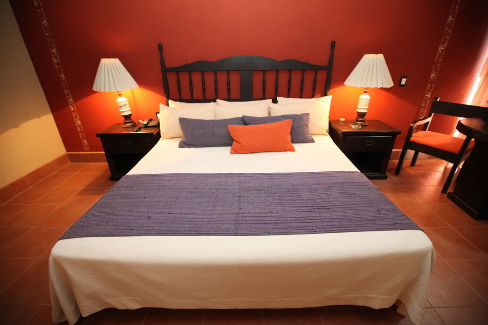 Hotel Montetaxco Extérieur photo A bed